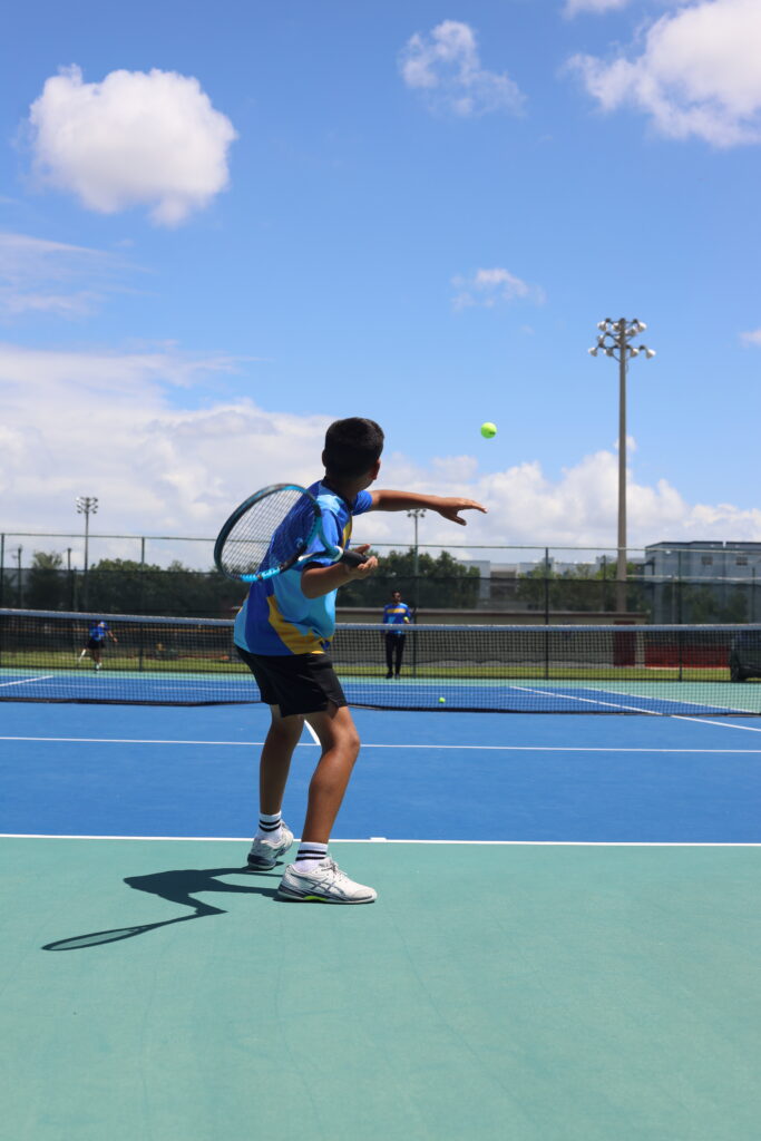 Boy training at tennis academy for kids in Doral