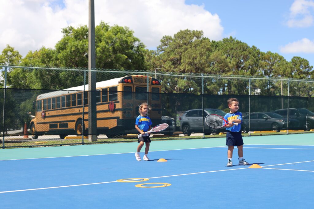 Children playing tennis in miami gardens