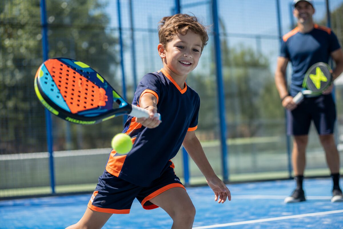 Junior player enjoying padel at Ale Tennis Academy